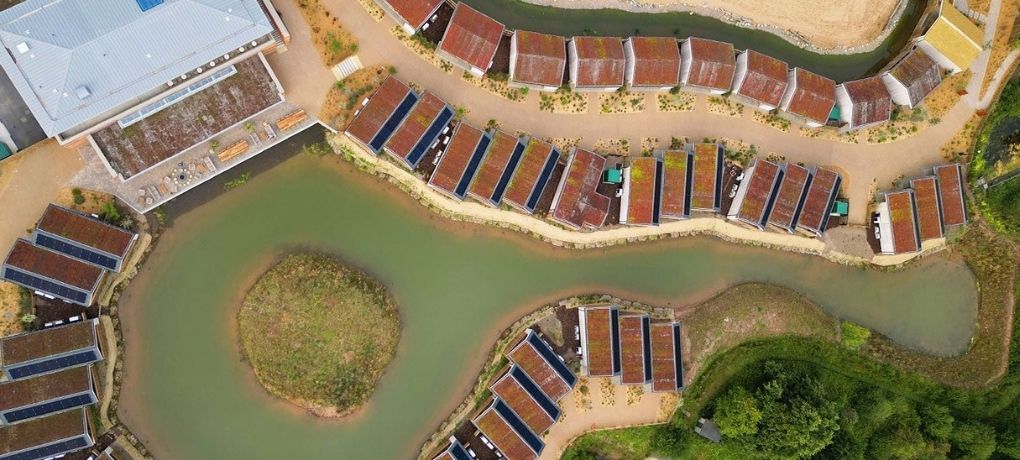 New visitor accommodation lodges set within the landscaped grounds of Chester Zoo, Upton-by-Chester, Cheshire.